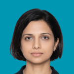 A headshot of Sheila Nursimhulu with a blue background